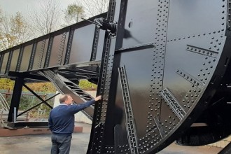 Swansea's restored Bascule Bridge which is on the move ready to be lifted back into its permanent position over the River Tawe. (Image: Swansea Council)