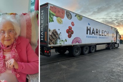Dorothy Edwards known as Granny Dot seated in a pink jacket, alongside a Harlech Foodservice delivery truck at sunset