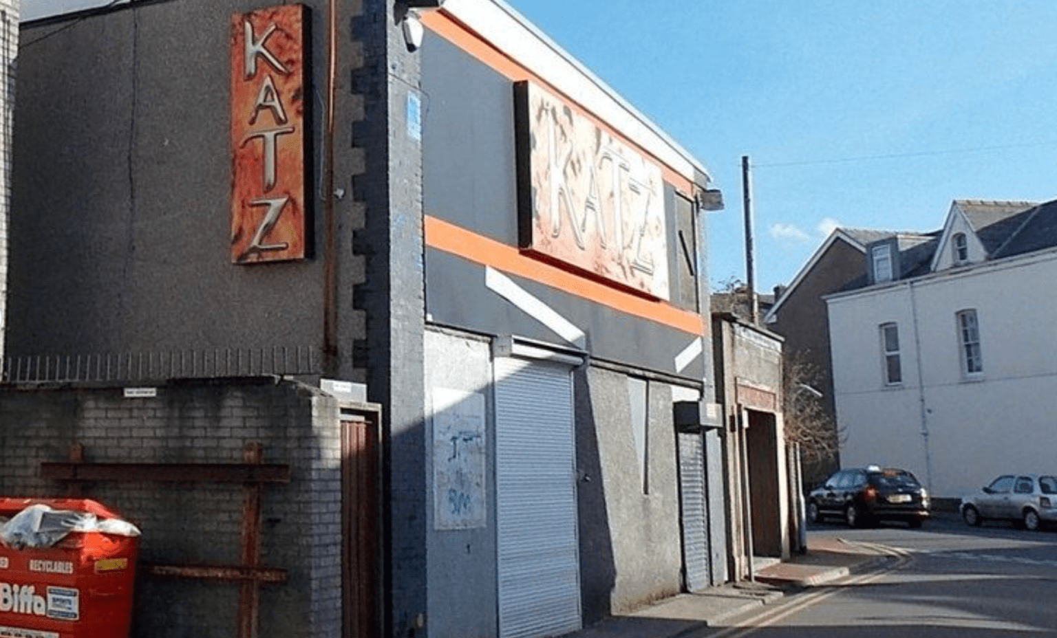 Exterior of the former Katz nightclub in Neath showing faded signage and boarded-up entrance