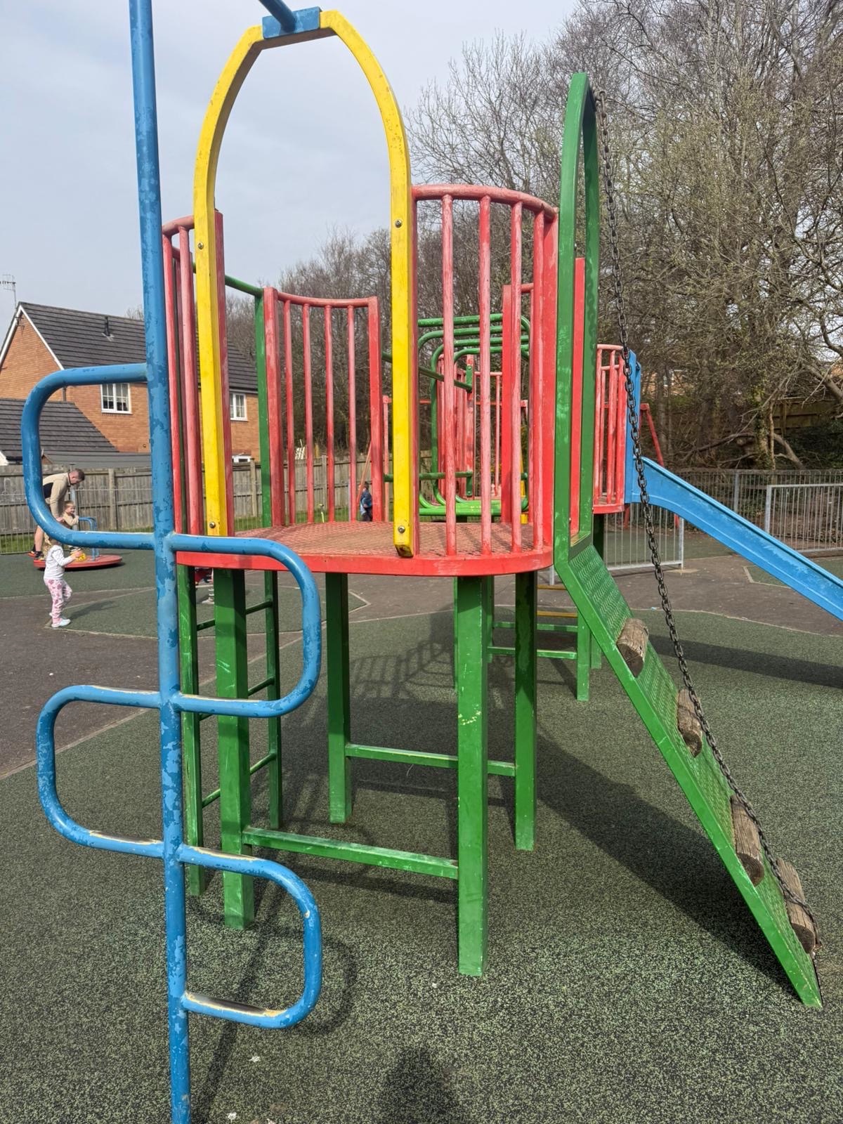 Ageing climbing frame with slide at Coed Hirwaun play park, Port Talbot
