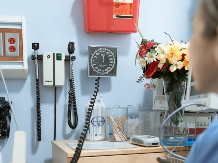 a person looking the sphygmomanometer hanging on the wall