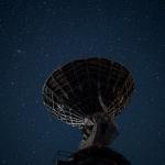 radio telescope under bright starry sky