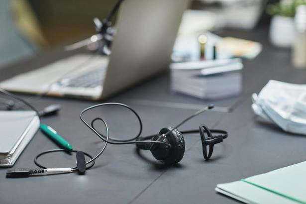 headphones with microphone on desk in call center