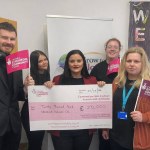 Emma Snell and members of the project receiving the grant from The National Lottery Community Fund