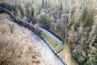 Aerial view of stone-walled drainage channelling and access path forming part of coal tip safety mitigation works at the Duffryn site near Cwmgwrach.