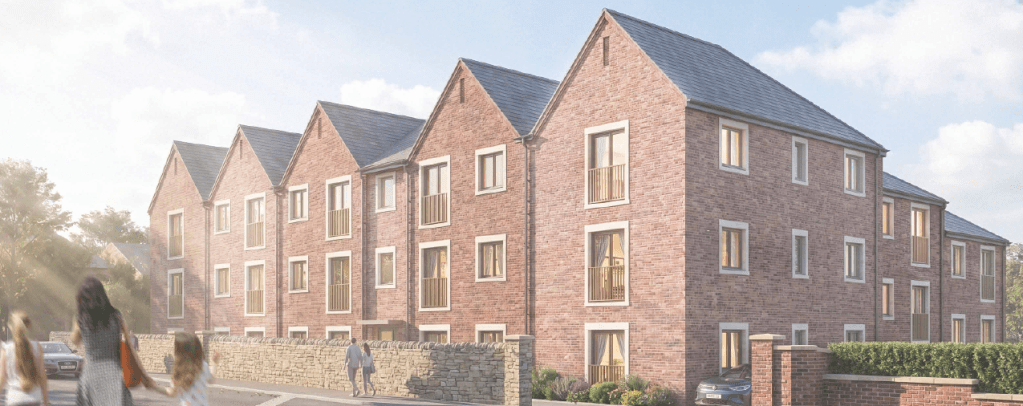 A computer-generated visualisation of a proposed three-storey red brick apartment block with five gabled bays, slate roofs, white-framed windows and small balconies, set behind a low stone boundary wall with a family walking past in the foreground