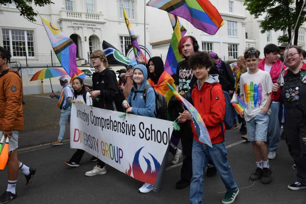 Young people from Treorchy Comprehensive School's diversity group march through Swansea city centre carrying rainbow flags and their school diversity group banner during the Swansea Pride 2026 parade, having travelled from the Rhondda Valley to take part.