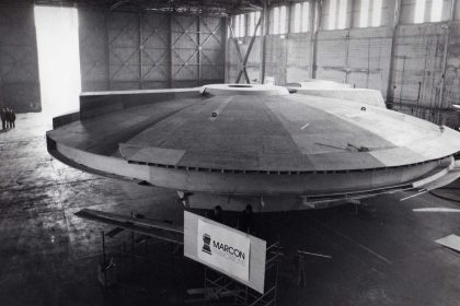 Image of the Millennium Falcon as used in the Western Daily Telegraph in 1979, and the Falcon partially seen through the open doors of the Western Hangar at Pembroke Dock