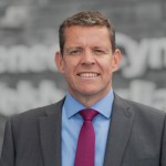 Rhun ap Iorwerth standing outside the Senedd building