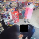 CCTV footage showing Richard Wolsey inside a convenience store carrying a large Cadbury's chocolate display stand
