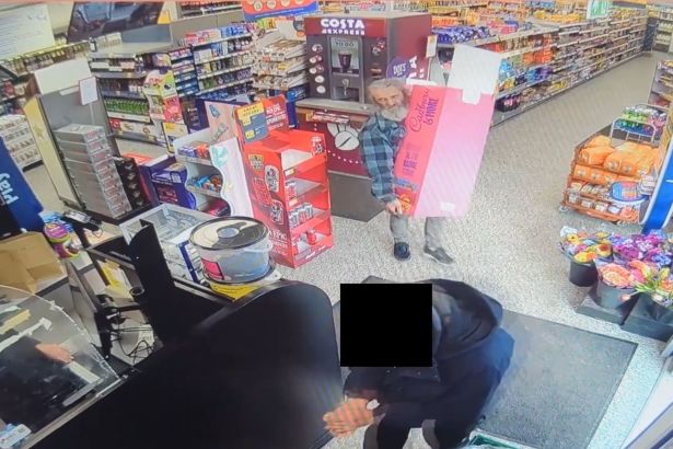 CCTV footage showing Richard Wolsey inside a convenience store carrying a large Cadbury's chocolate display stand