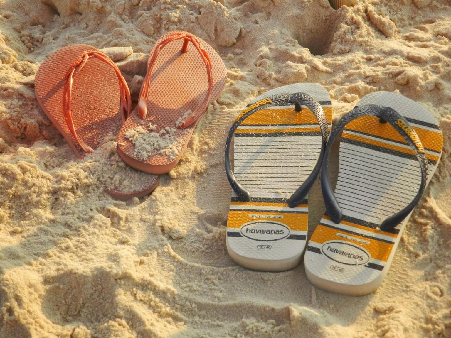 colorful sandals on rio de janeiro beach sand