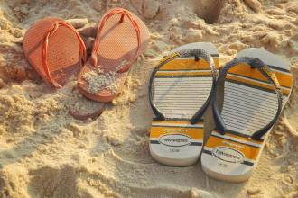 colorful sandals on rio de janeiro beach sand