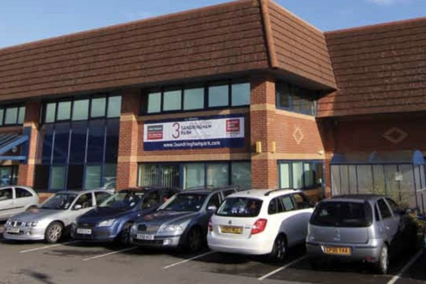 A two-storey brick office building at Sandringham Park, Swansea Vale, with cars parked outside and a "3 Sandringham Park" sign on the front.