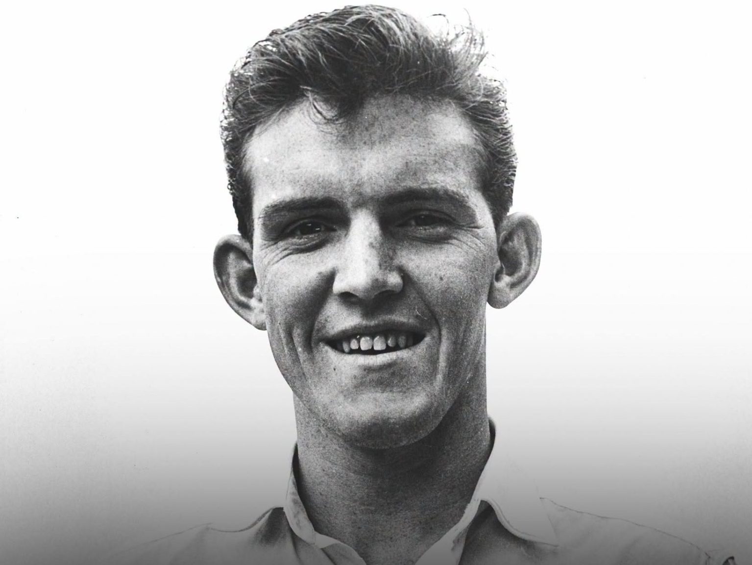 A black-and-white photograph of Swansea City footballer Herbie Williams in a club shirt