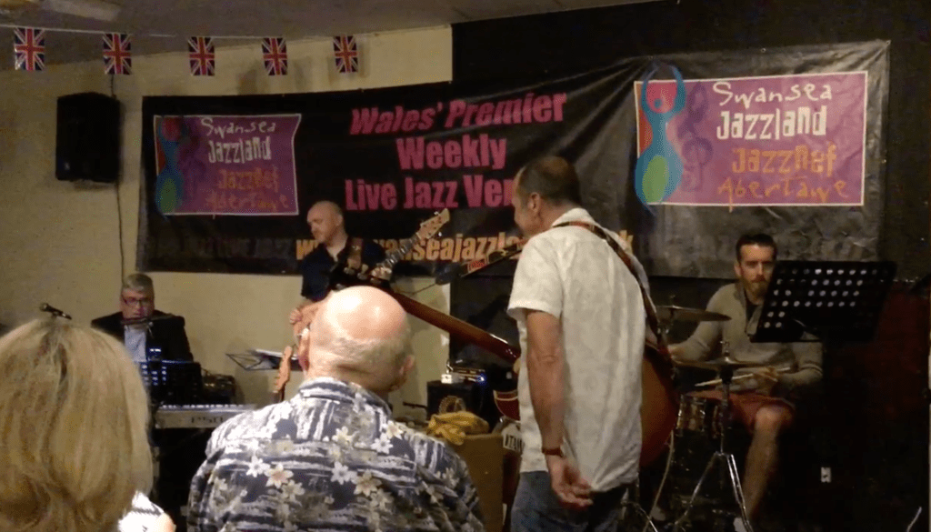 Four musicians performing on the final night at the St James Club in 2018, with Dave Cottle on piano