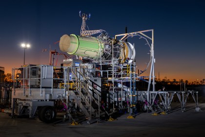 A jet engine mounted on a test rig at dusk, part of the Rolls-Royce and easyJet hydrogen programme.