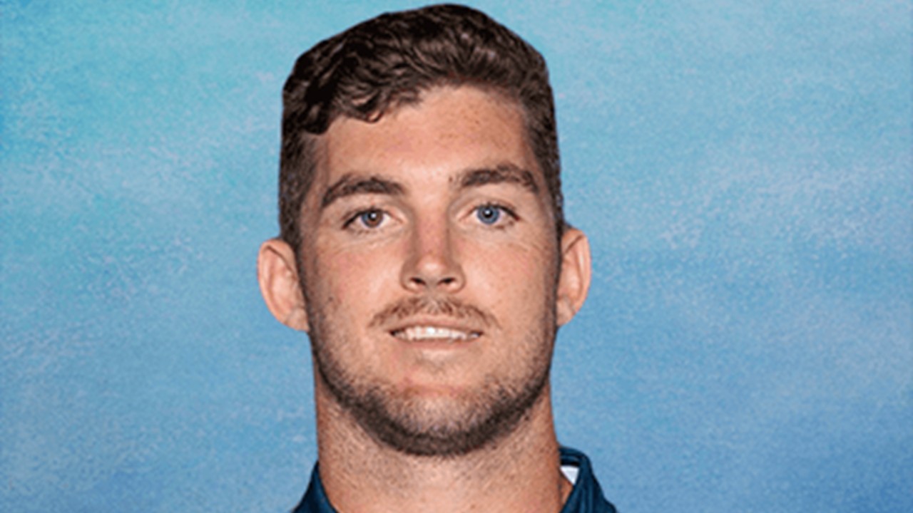 Head-and-shoulders portrait of rugby player Lawson Creighton against a pale blue background.