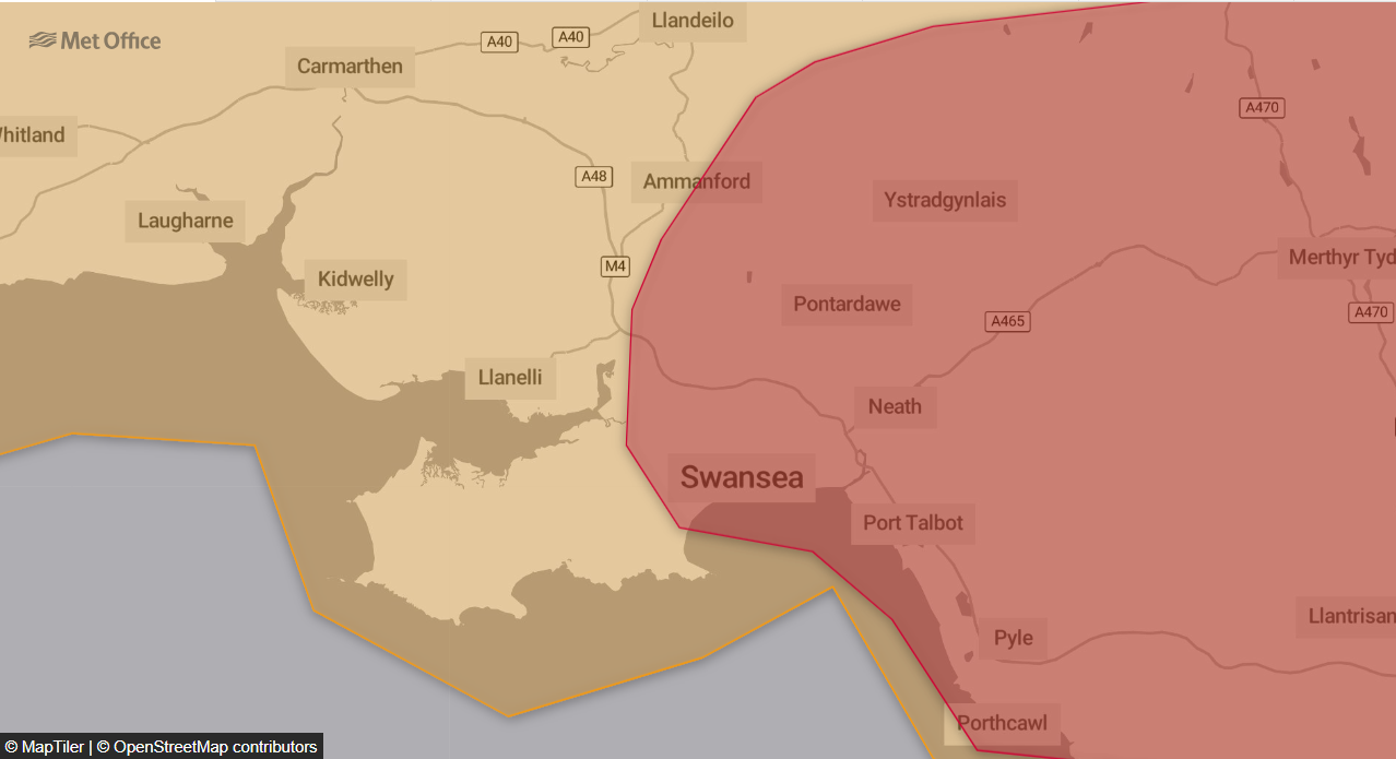 A Met Office map showing the red extreme heat warning boundary running through Swansea, Neath and Port Talbot, with Llanelli and Carmarthen in the amber zone.