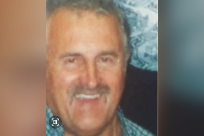 Brian William Bodenham, an 80-year-old man with grey hair and a moustache, smiling.