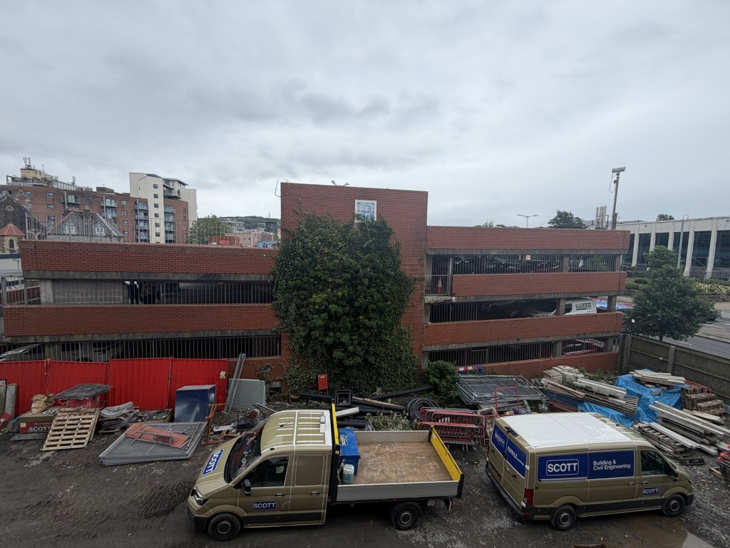 Andrew Scott vans on site, with the ageing St David's multi-storey car park behind — due for demolition once Copr Bay North opens. (Image: Swansea Bay News)