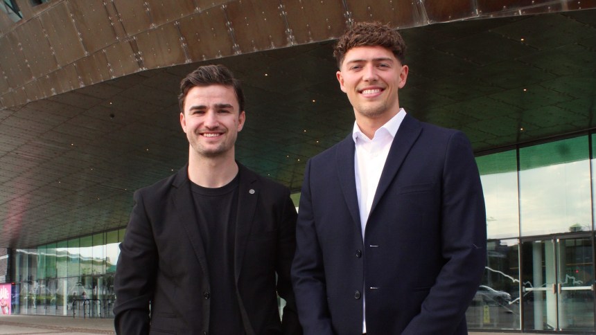 Leapfrog Advertising co-founders Fraser Dickson and Ethan Evans standing outside the Wales Millennium Centre.