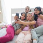girls in pajamas taking selfie