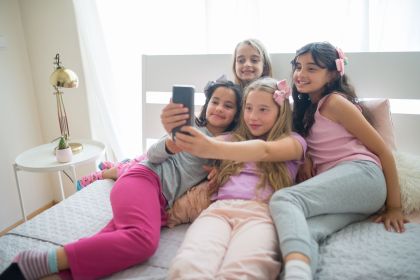 girls in pajamas taking selfie