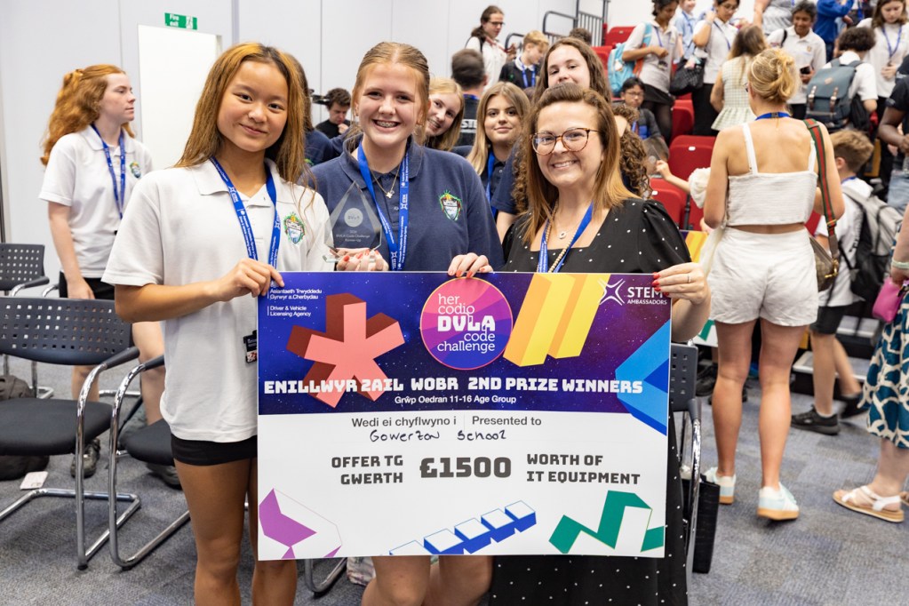 Gowerton Comprehensive School pupils holding their runners-up cheque for £1,500 of IT equipment at the DVLA Code Challenge awards