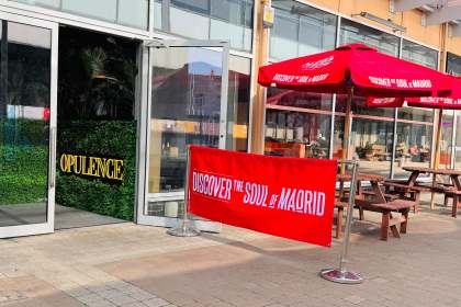 The entrance to Opulence bar at Eastgate, Llanelli, with its name in gold lettering on a foliage wall