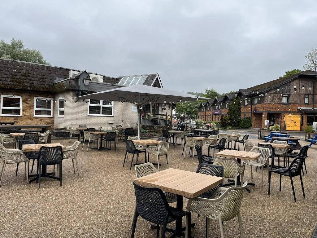The bar and servery inside the Bagle Brook, with drinks fridges and hand pumps