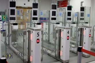 Passengers using the automated eGates at Cardiff Airport's arrivals hall