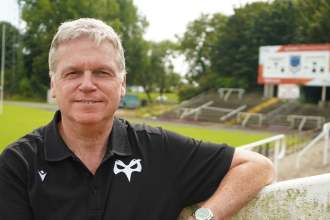 Ospreys chief executive Lance Bradley in an Ospreys polo shirt at St Helen's