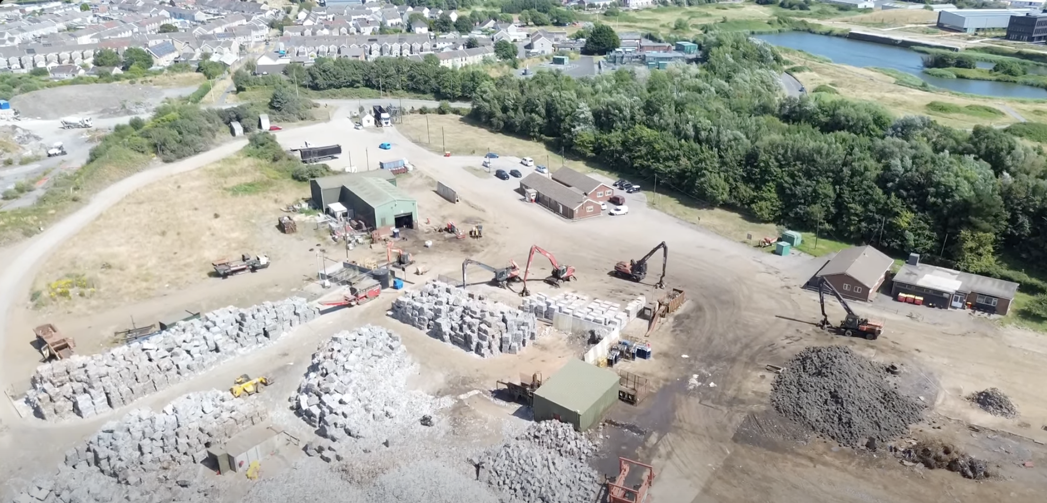 Aerial view of the yard at the AMG Resources site in Llanelli with machinery and baled material