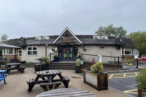 Exterior of the Bagle Brook Beefeater in Baglan, showing the sign, entrance and picnic benches