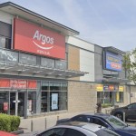 The Argos store front at Parc Pemberton retail park in Llanelli, with a bilingual Hello Llanelli sign beside the entrance