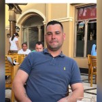 Ashley Wayne Keane, wearing a blue polo shirt, in a photo released by his family through Dyfed-Powys Police