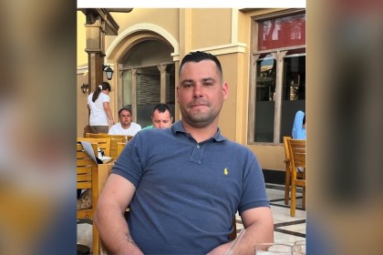 Ashley Wayne Keane, wearing a blue polo shirt, in a photo released by his family through Dyfed-Powys Police