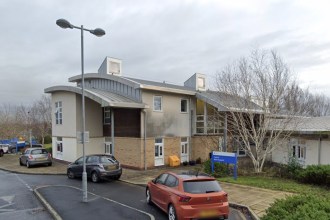 Exterior of Bryngofal Ward at Prince Philip Hospital, Llanelli, with the blue NHS ward sign visible by the entrance.