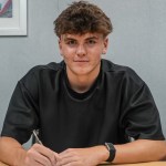 Carter Heywood signing his first professional contract at Swansea City.