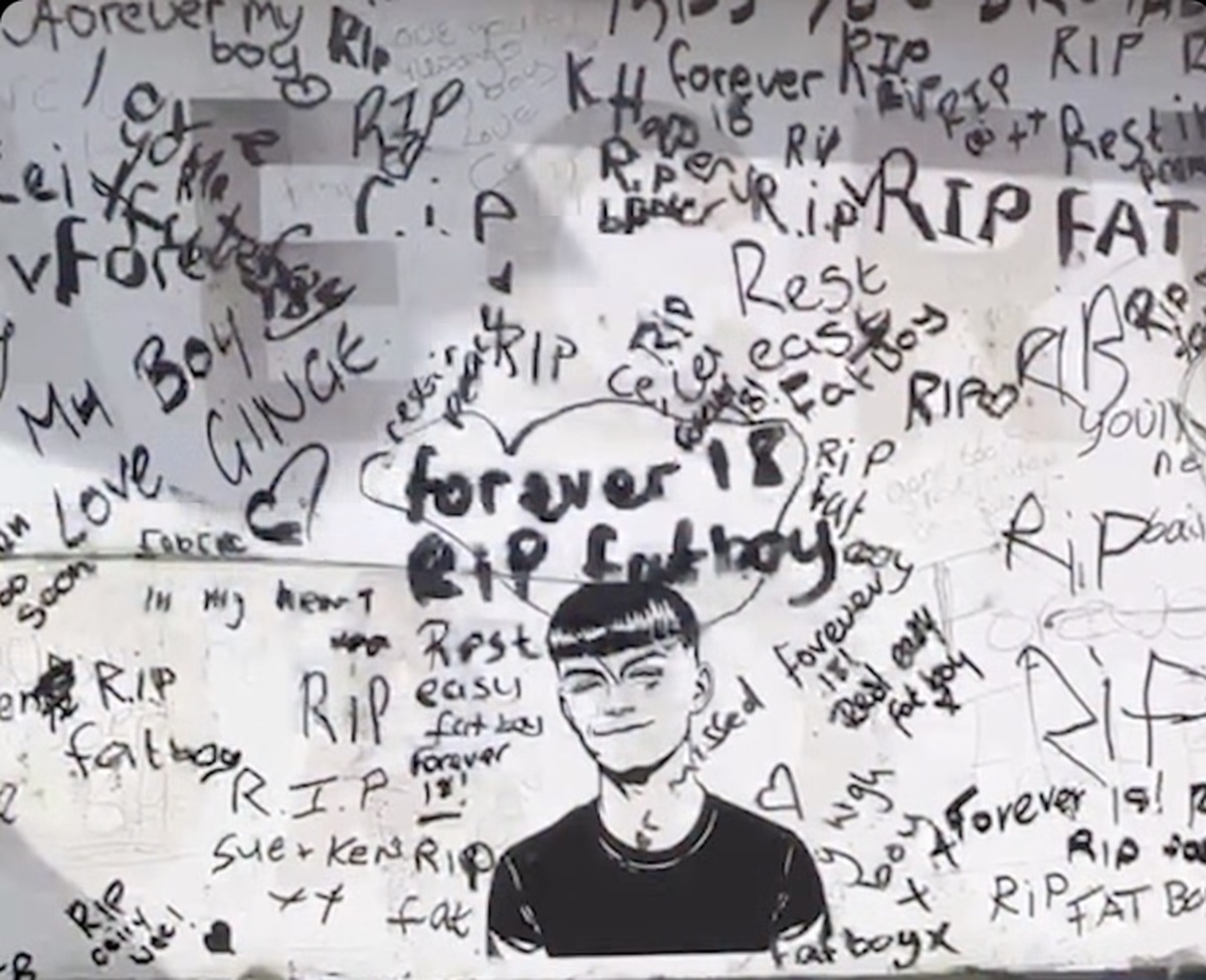 A wall of handwritten tributes around a drawn portrait of Ceiran Evans, reading forever 18 and rest easy Fatboy