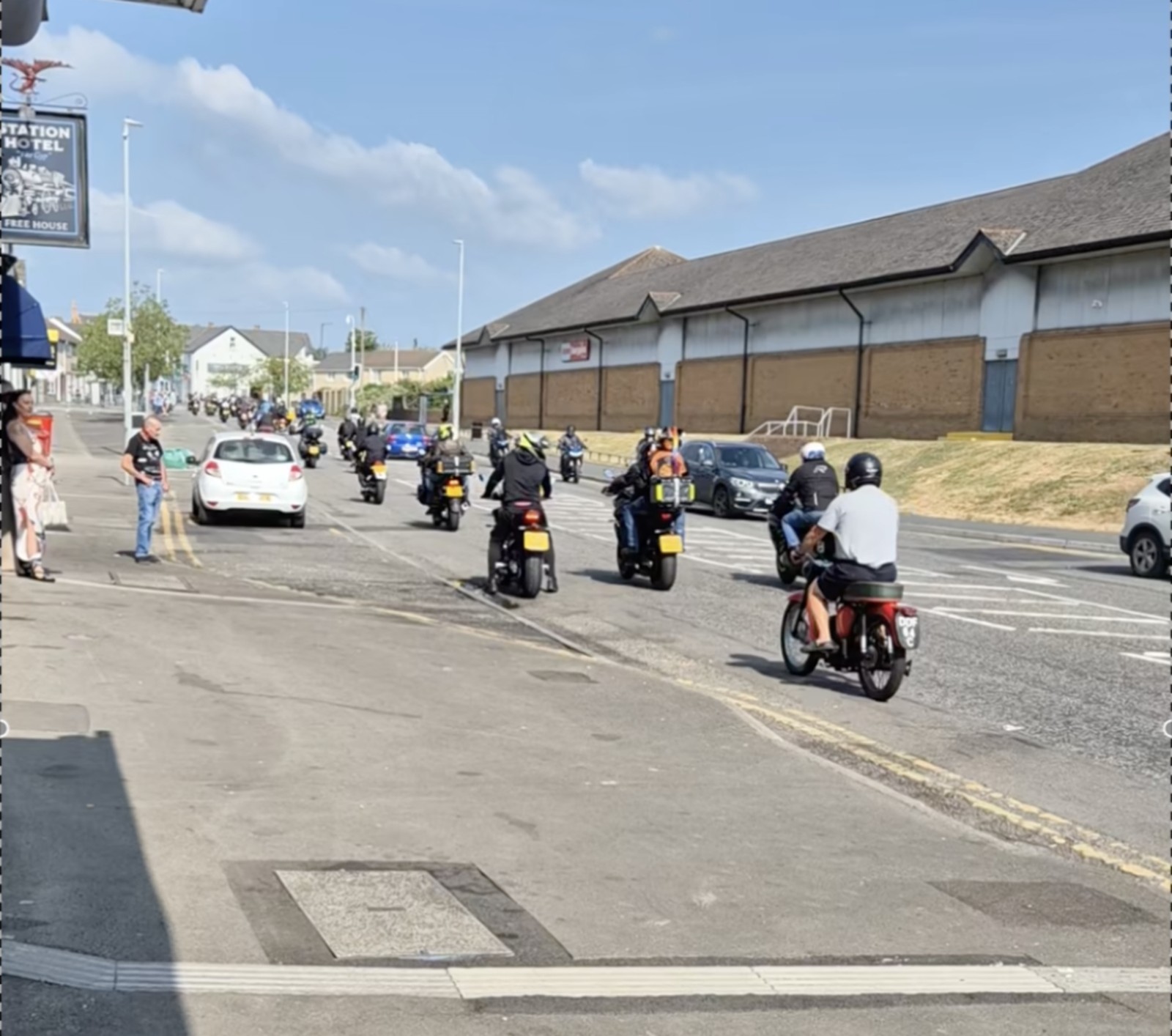 Motorbikes filling the full width of a street during the memorial ride-out