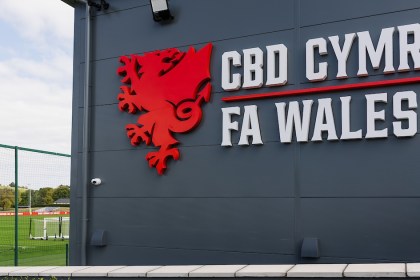 The FA Wales and CBD Cymru sign with the red dragon crest on the wall of the association's headquarters building