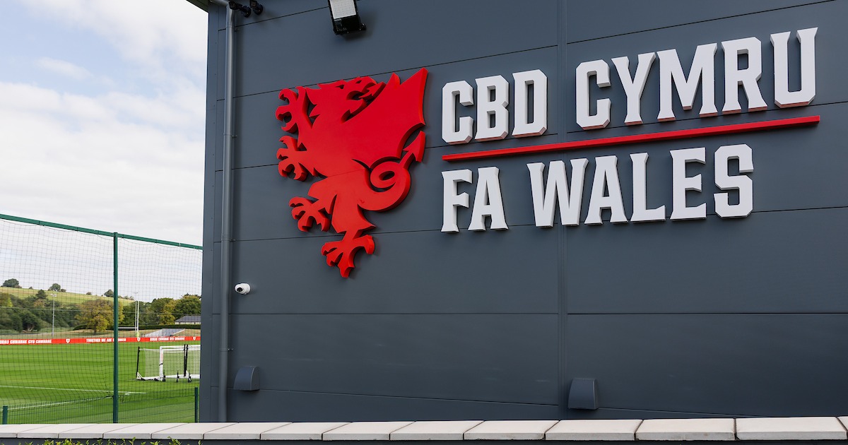 The FA Wales and CBD Cymru sign with the red dragon crest on the wall of the association's headquarters building