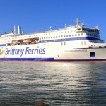 The Brittany Ferries ship Guillaume de Normandie at sea, a large white ferry with blue branding