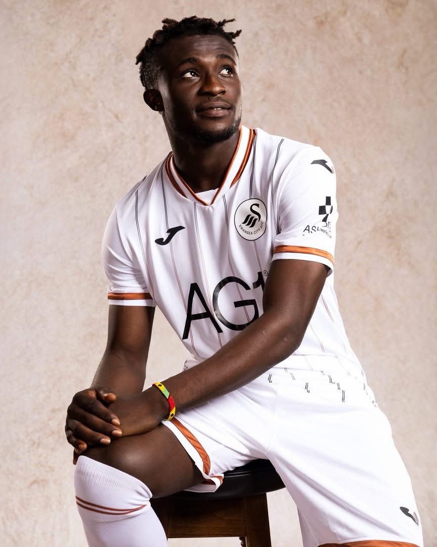 A Swansea City player wearing the full 2026-27 home strip of shirt, shorts and socks