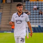Liam Cullen on the pitch in Swansea City's white kit during the pre-season tour of Austria