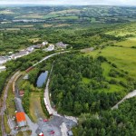 Aerial view of the Llanelli and Mynydd Mawr Railway heritage line and rolling stock at Cynheidre, surrounded by fields and woodland