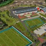 An aerial artist impression of the new Mynydd Cynffig Primary School at Kenfig Hill, showing the school building with solar panels, sports pitches, play areas and a car park