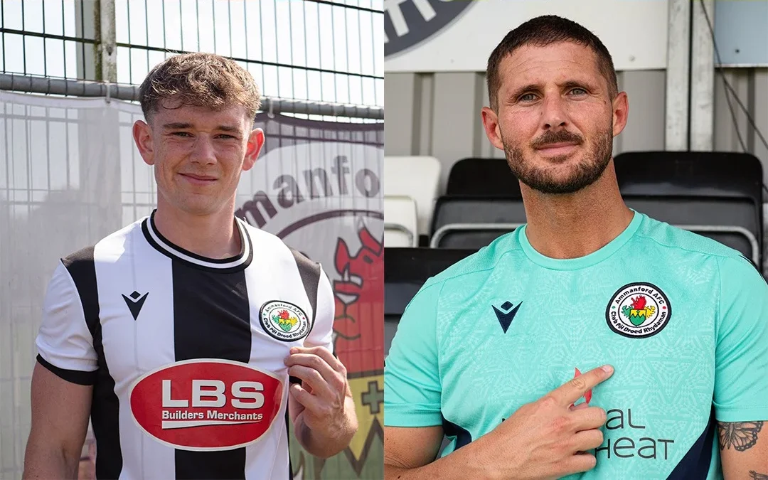 Ammanford AFC players model the new black-and-white home shirt and turquoise away shirt